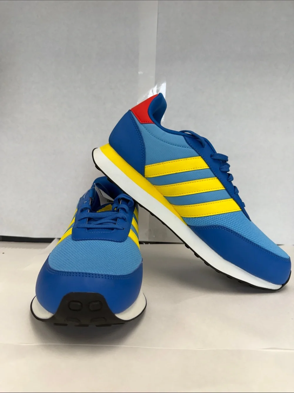 adidas Men's Blue Sneakers with Yellow Stripes and Red Heel Accent